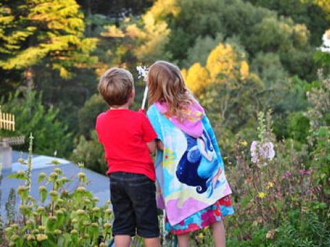 Kids drinking from hose