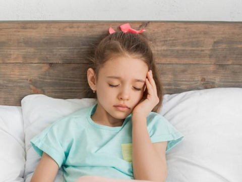 Girl sick in bed