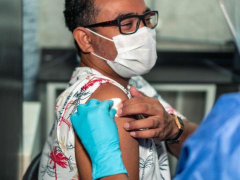 Man getting gauze pad after vaccination