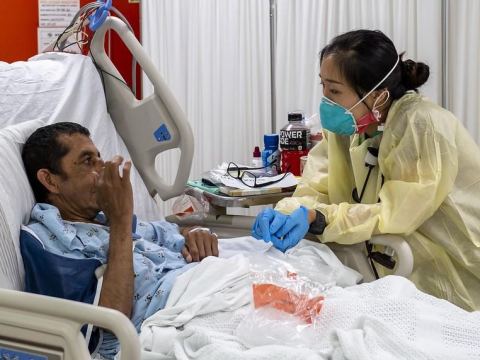 Man taking pill in hospital