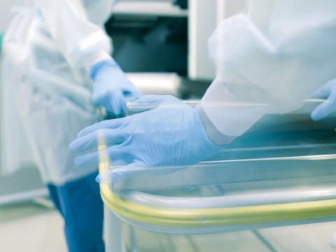 Moving body into morgue cold storage