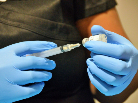 Nurse readying vaccine