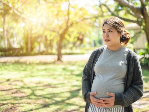 Pregnant woman in park