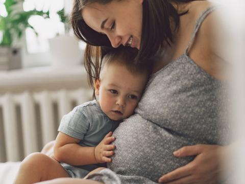 Pregnant woman with young child