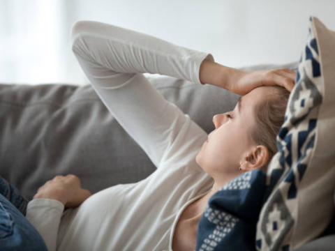 Exhausted woman on couch