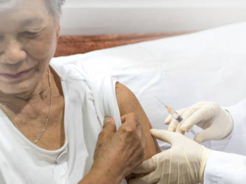 Woman receiving shingles vaccine