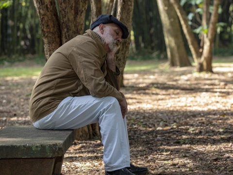 Tired man in park