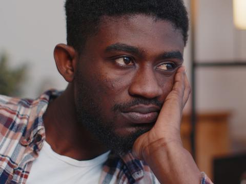Unhappy young Black man