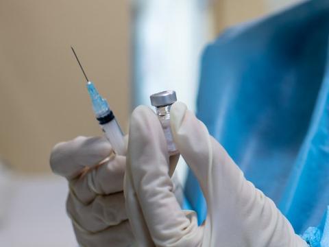 Vaccine vial and syringe