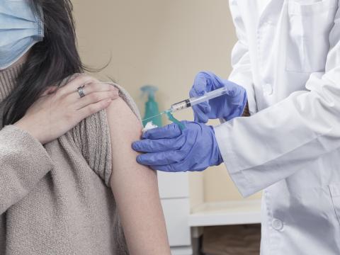 Woman being vaccinated