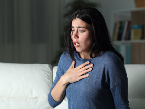 Woman having asthma attack