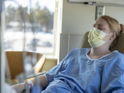 Woman in labor wearing mask