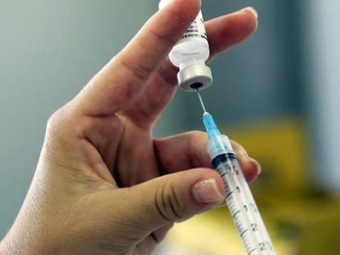 Woman holding syringe