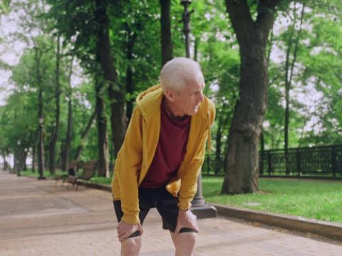 Older man in park with shortness of breath