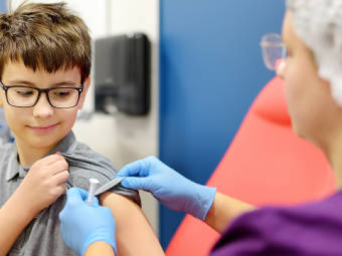 Young boy getting vaccinated