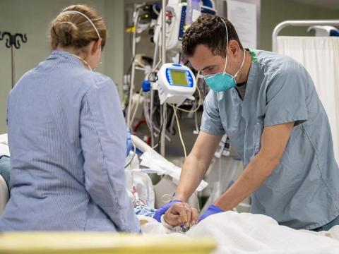 Doctors with COVID patient in hospital