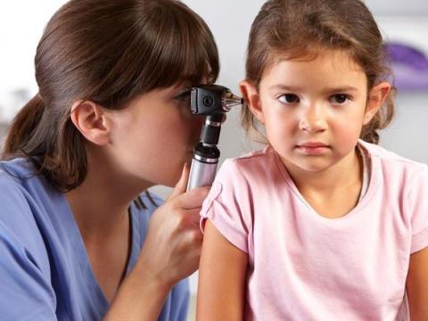 Ear exam of young girl