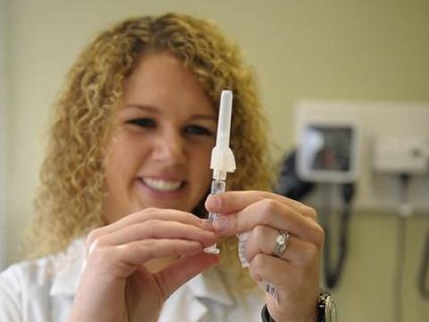 Health worker preparing flu shot