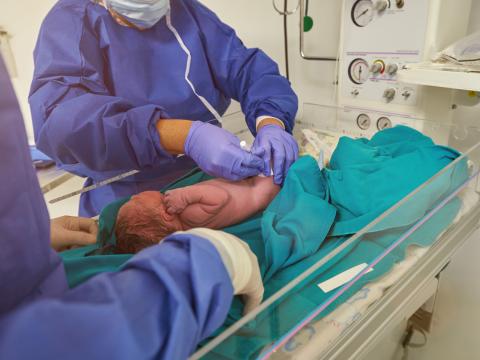 Doctor vaccinating newborn