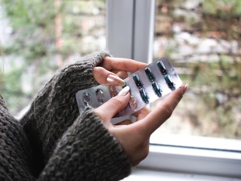 Woman holding antibiotics