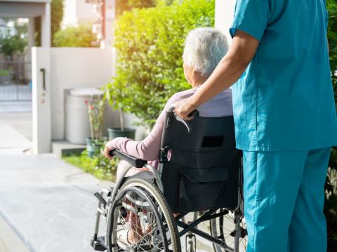 Elderly woman in wheelchair