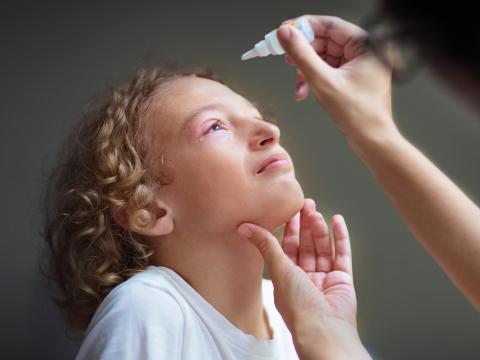 Child with pink eye