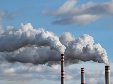 Smoke stacks and white smoke