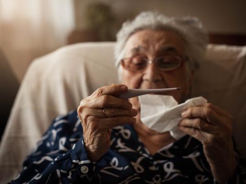 older woman checking temp