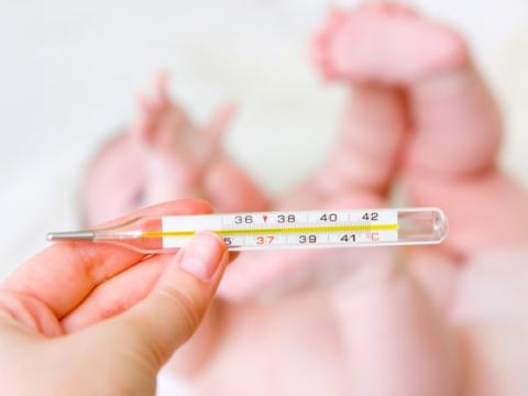 Baby with thermometer