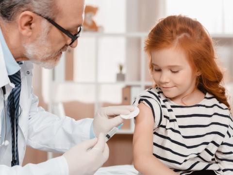 Girl receiving vaccine