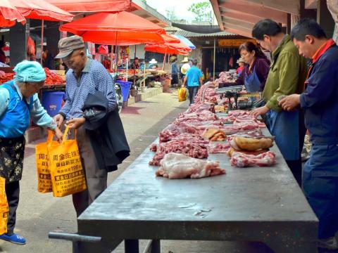 Chinese meat stall in outdoor market