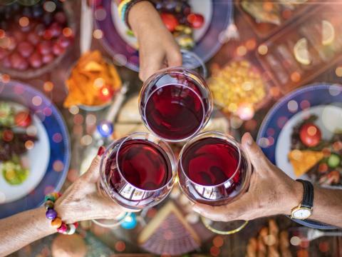 Clinking wine glasses at Thanksgiving