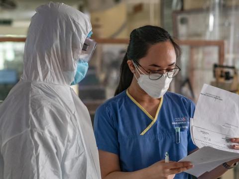 Health workers in COVID-19 protective equipment