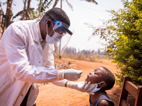 Boy getting COVID nasal swab