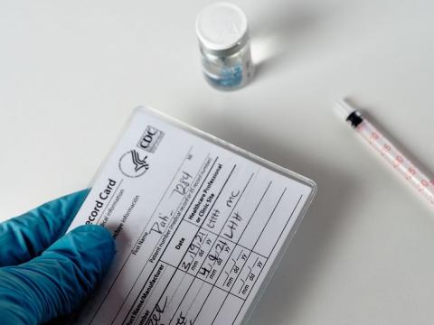 COVID vaccine card, vial, syringe