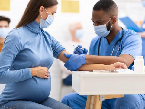 Pregnant woman getting COVID-19 vaccine