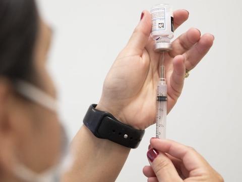 COVID vaccine vial and syringe