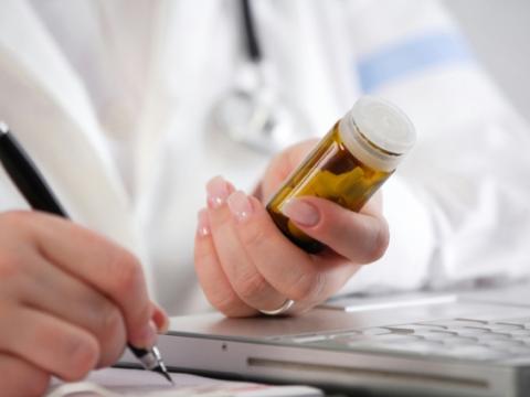 Doctor writing prescription