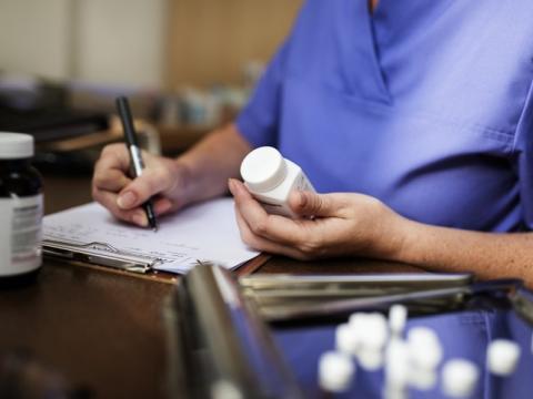 Doctor writing prescription