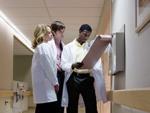 Doctors consulting in hallway