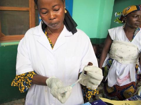 Healthcare worker preparing vaccine