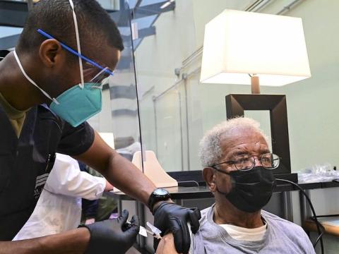 Elderly man getting COVID-19 vaccine