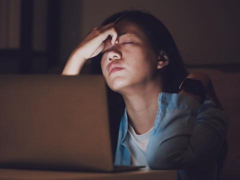 Exhausted woman at computer