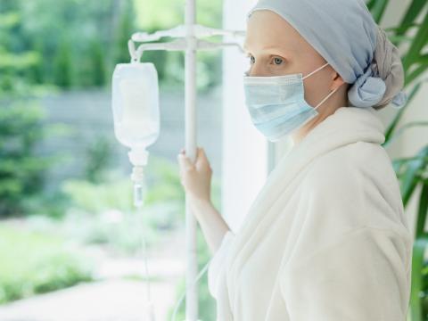 Female cancer patient by window