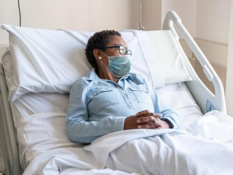 Female hospital patient wearing mask