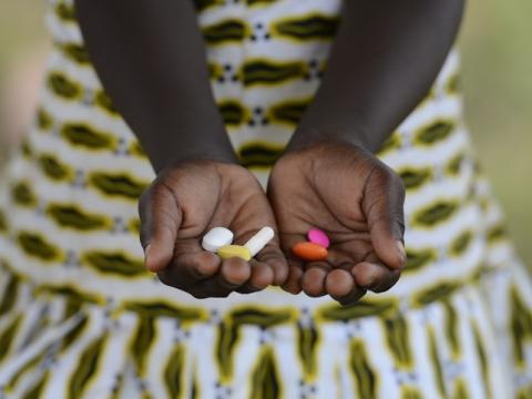 Girl in Africa with pills