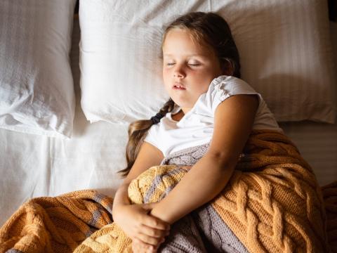 Girl sleeping in bed