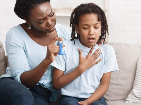 Girl with asthma mom with inhaler