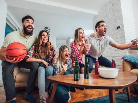 Group at home cheering on basketball team