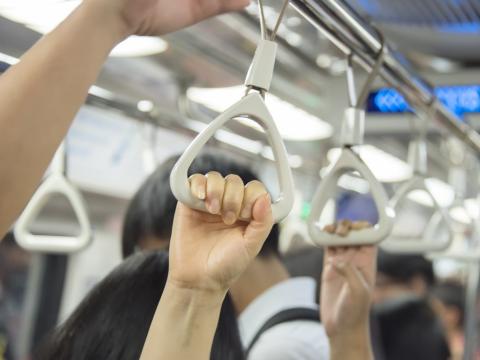 Hands on subway straps